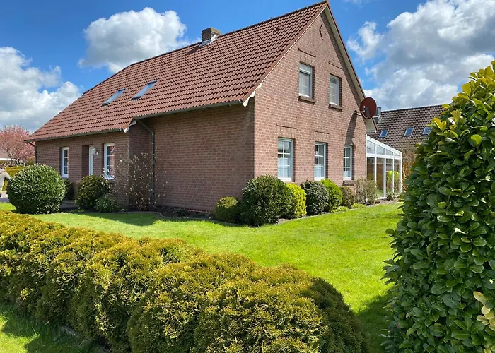Photo de Ferienhaus Sandhoecht Großheide